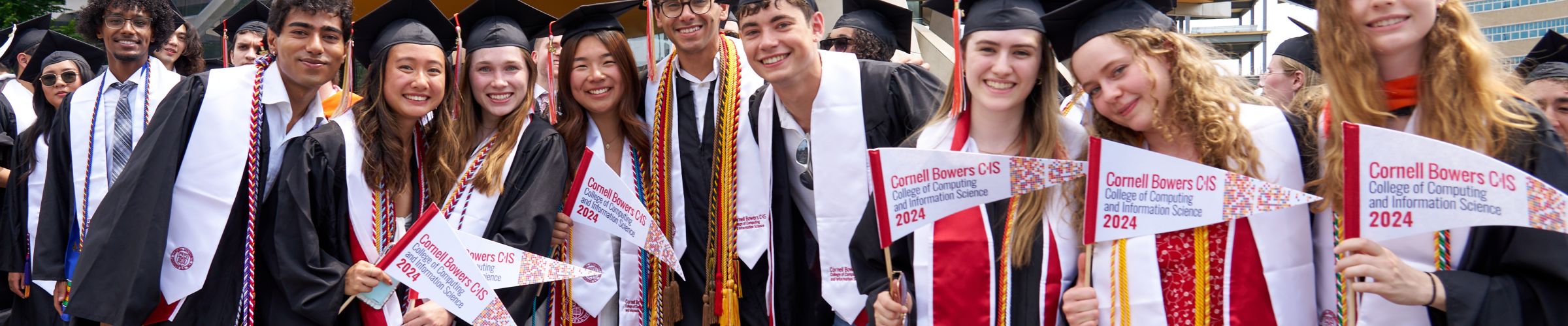 A color photo showing students in front of Gates Hall