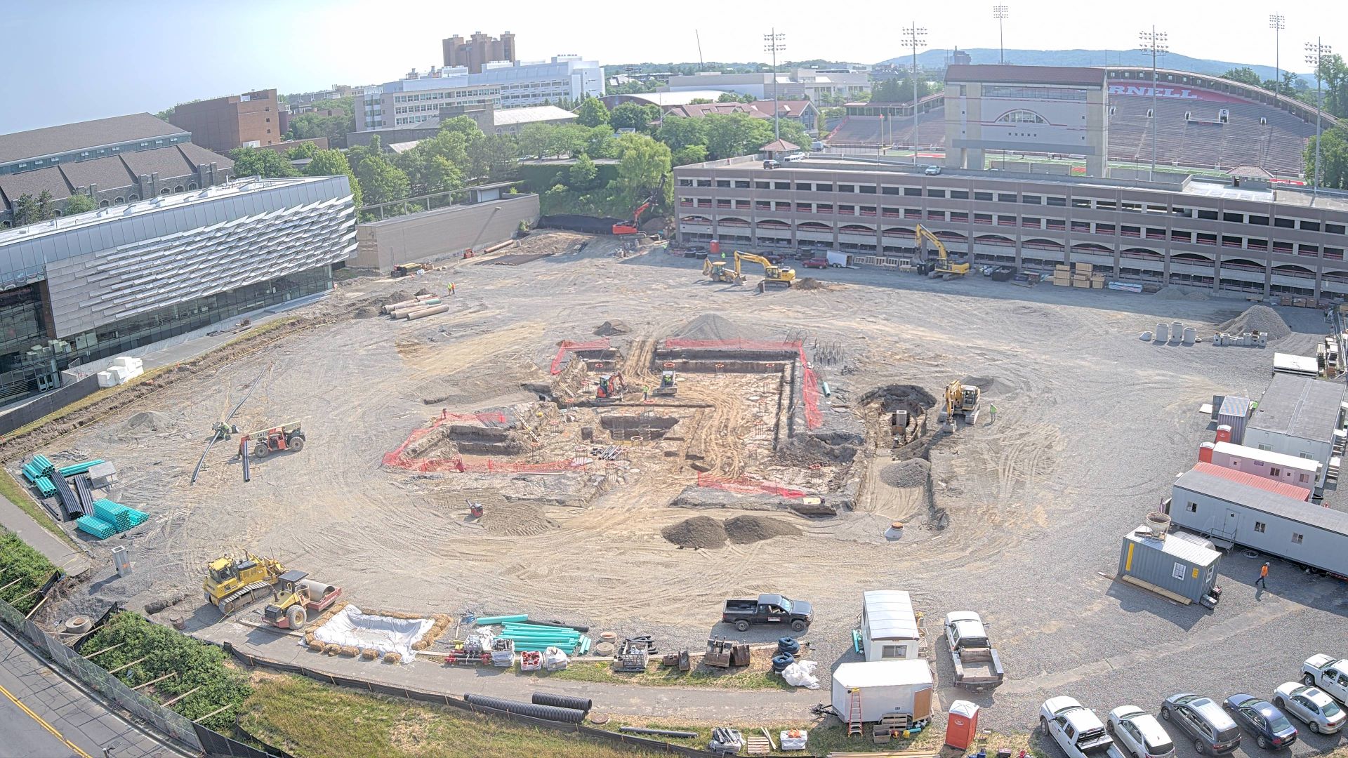 Active construction site. Large equipment throughout.