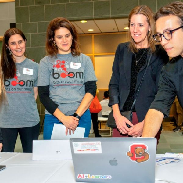 Dave Burbank for Cornell University At BOOM 2023, students demonstrate AI-Learners, a platform that helps kids learn math and literacy with games.