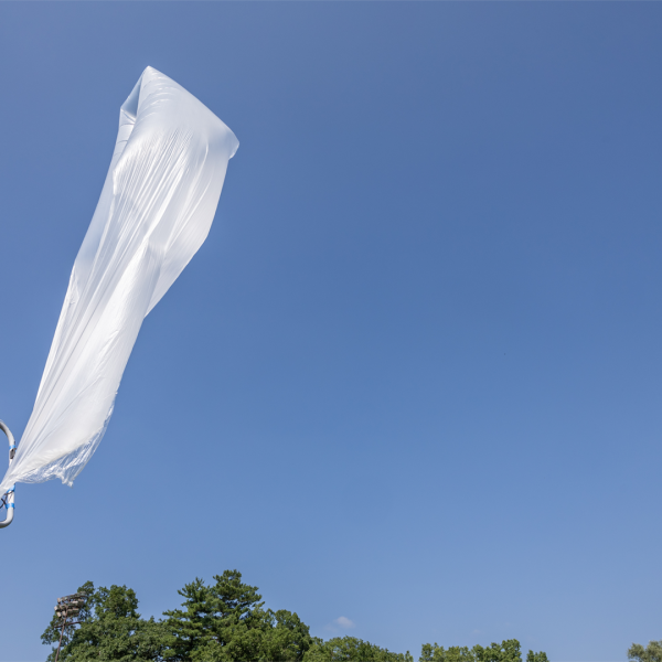 A color photo showing a balloon about to take flight.