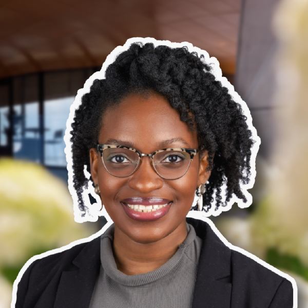 A color photo of a woman smiling for a photo