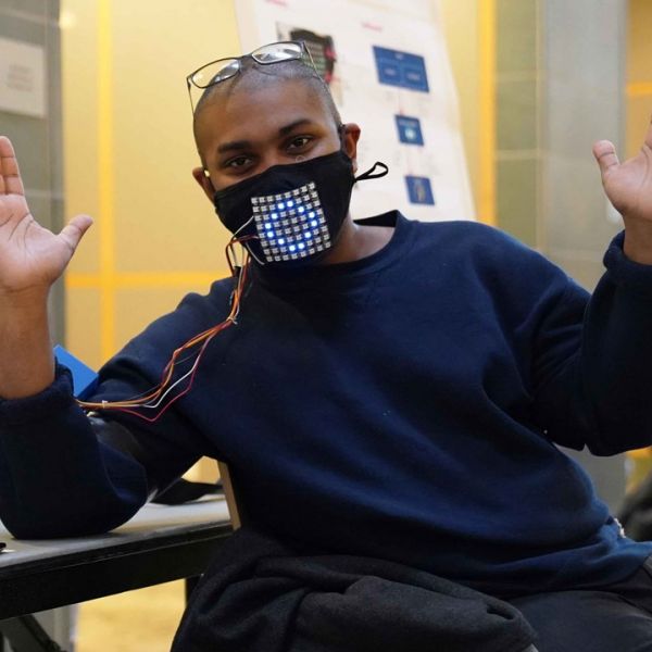 student wears mask with LED display to both read and display four facial expressions 