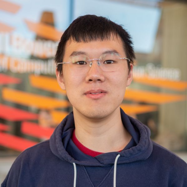 A color photo of a man smiling for a photo