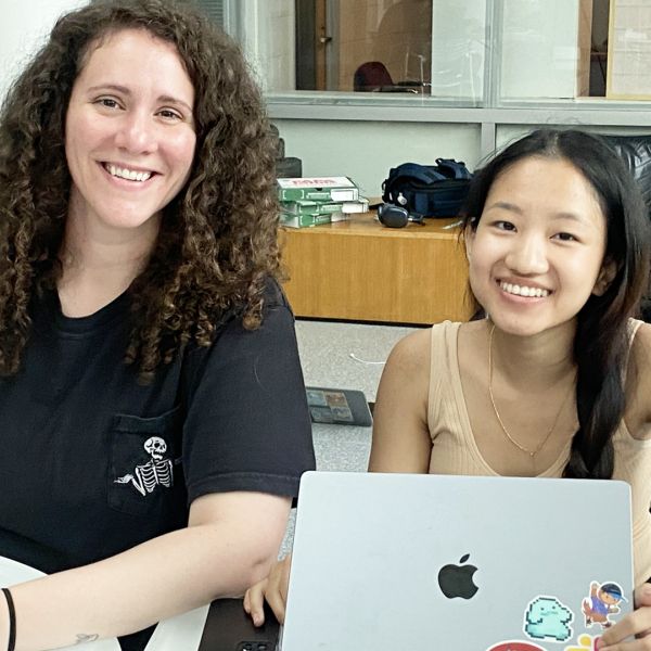 A color photo showing 2 student participants at the GDIAC showcase