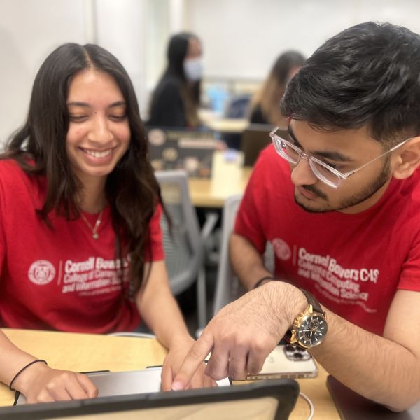 A color photo showing students smiling for a photo