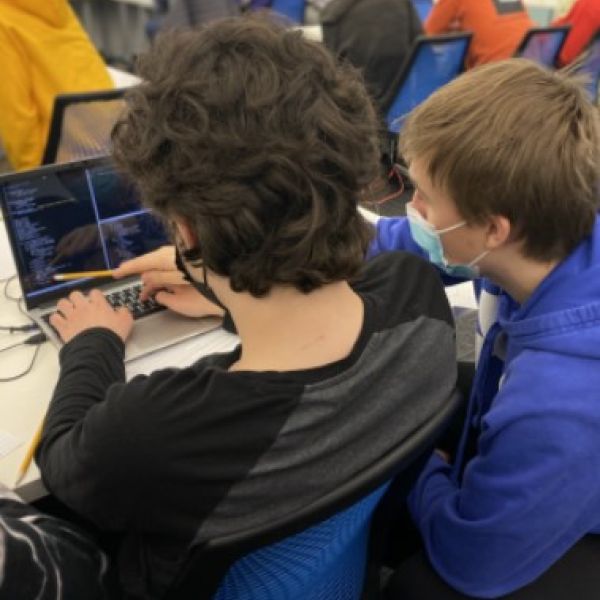 students write code on computer