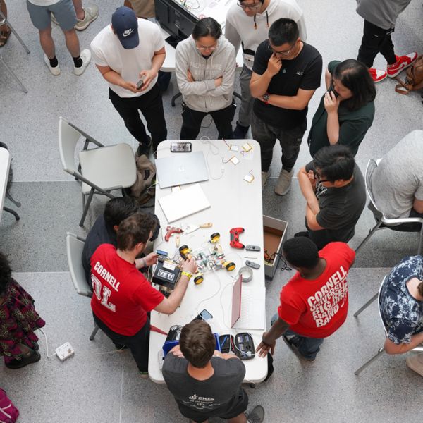 An overhead photo of a group of students working on a project