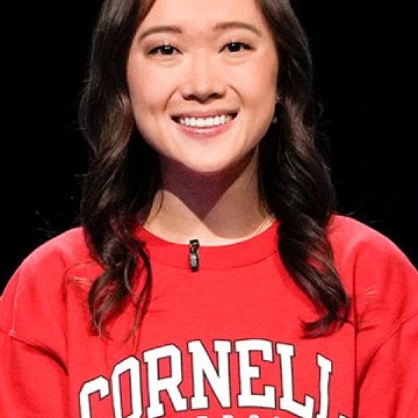 Woman looking at camera wearing red Cornell sweatshirt