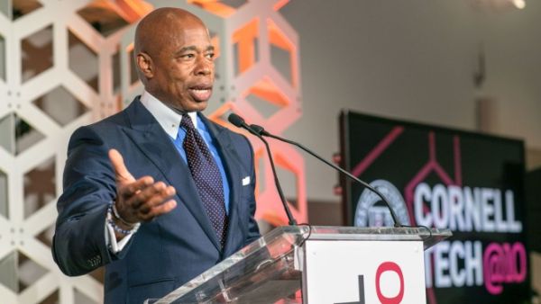 New York City Mayor Eric Adams spoke at the 10th anniversary celebration about the importance of institutions like Cornell Tech in helping grow the city's tech sector. NYC Mayor Eric Adams speaking at podium