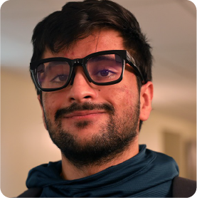 A color photo of a man wearing smart glasses