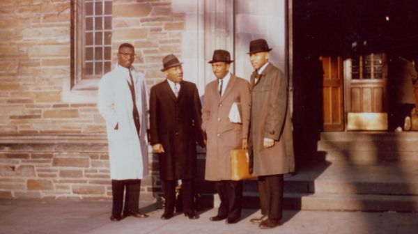 Provided by the family of Dr. Edward Hart Martin Luther King Jr. and colleagues stand outside Anabel Taylor Hall on Nov. 13, 1960, during King’s first visit to Ithaca. Left to right: Kenneth Hagood ’60, a Cornell student organizer; Martin Luther King Jr.;