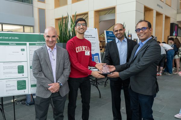 A color photo showing the Infosys Award winner(s) and presenters of the award.