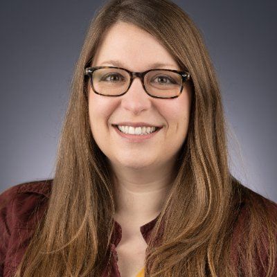 Melissa Osgood A color photo of a woman smiling for a photo