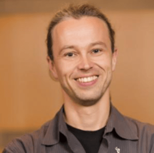 Thorsten Joachims A color photo of a man smiling for a photo
