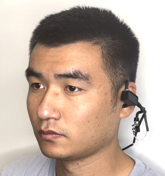 A man wears a set of earphones