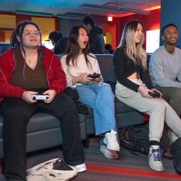 A color photo of people playing video games