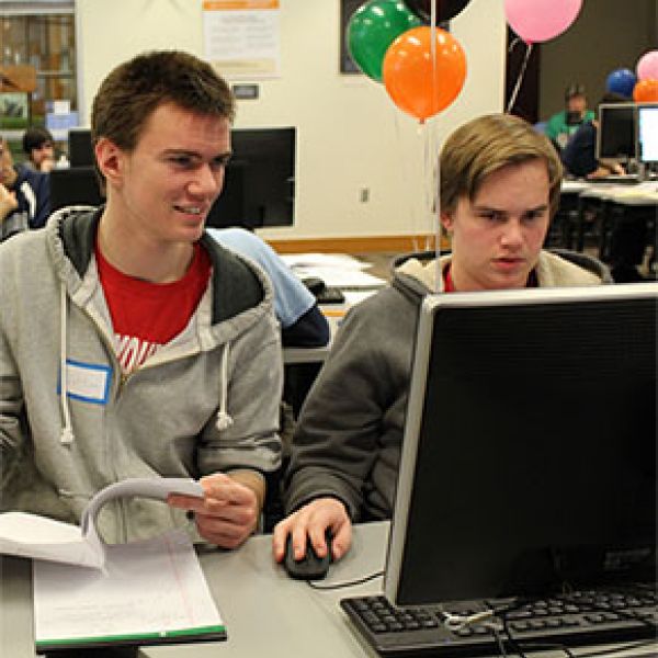 photo of high schoolers programming