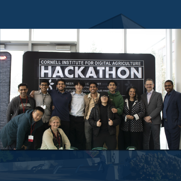 Credit: Abigail Younger - A color photo showing Members of "The Freshmen," the grand challenge winners at the hackathon, stand with judges, deans and mentors.