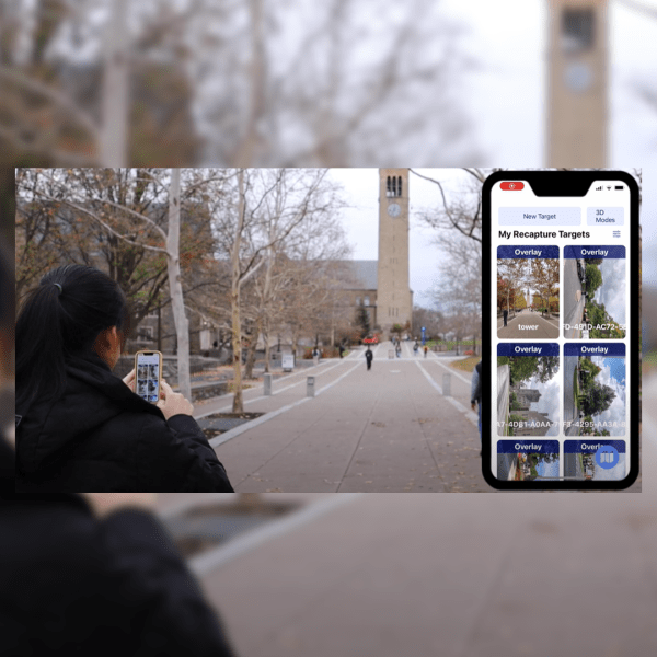 A color photo of a woman holding a phone on the Cornell campus.