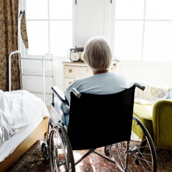 elderly woman in nursing home room